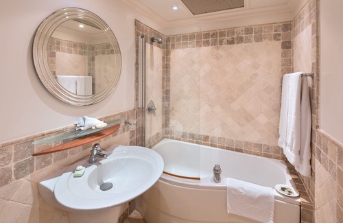 Schooner Bay Apartment | Schooner bay is a beachfront condominium with a freeform swimming pool as the focal point
