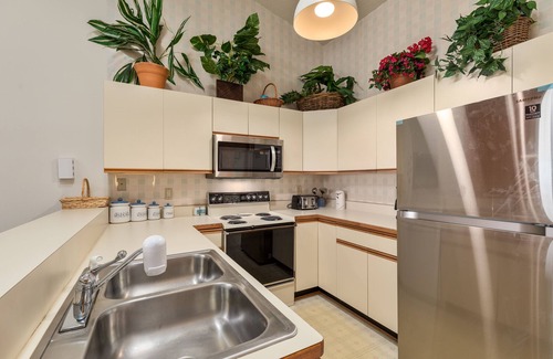 Kitty Hawk Condo | Sea Dunes condo with community pool and tennis, beach access, porch swing, baby gate, and WiFi