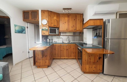 Għadira Apartment | Seafront apartment just steps from Mellieħa Bay, with stunning views of the bay and Red Tower. Enjoy spectacular sunsets, walk to nearby restaurants and amenities, and catch the bus right outside.