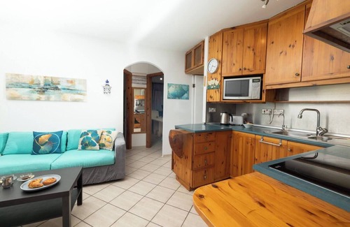 Għadira Apartment | Seafront apartment just steps from Mellieħa Bay, with stunning views of the bay and Red Tower. Enjoy spectacular sunsets, walk to nearby restaurants and amenities, and catch the bus right outside.