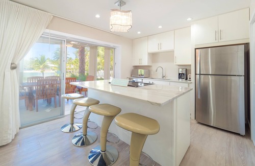 Rum Point House | Seaside Dreams: Contemporary Oasis on Bio-Bay With Two Free Kayaks