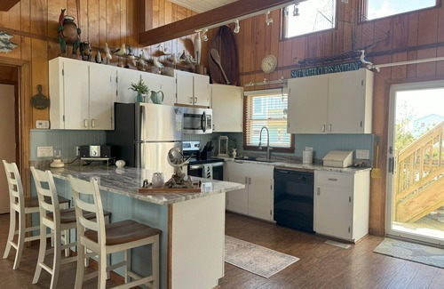 South Nags Head Cottage | SEMI-OCEANFRONT 70 Steps to Beach! 3 Decks/Ocean Views. Delightful Family Fun!