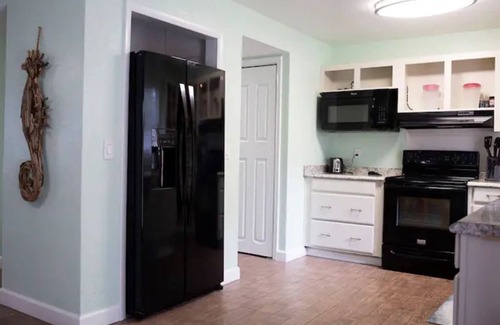 Port Saint John House | Serene Oasis: Saltwater Pool Home near KSC and Cocoa Beach"n