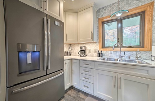 Rapid City House | Serene Riverfront Home w/Torch Lake Access!