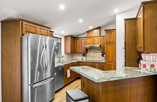 Fillmore House | Single-level home surrounded by lush gardens with a washer/dryer, AC, & wet bar
