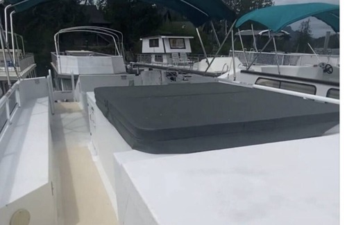 Lake Cowichan Boat Rental | “Snowbird” Houseboat with roof top Hot tub and Slide.