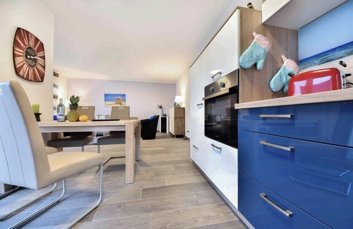Korswandt Apartment | Sonnenpark 05 - modern furnishings and terrace with beach chair