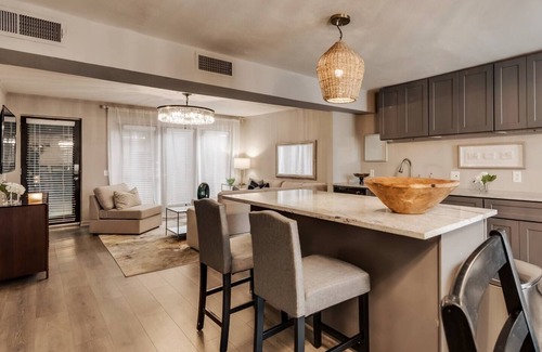 Old East Dallas Condo | Sophisticated 2-Bed, 1.5-Bath furnished condo in central Dallas with a private patio, serene garden views, and exclusive access to an award-winning courtyard equipped with premium wellness products and relaxing lounge areas.