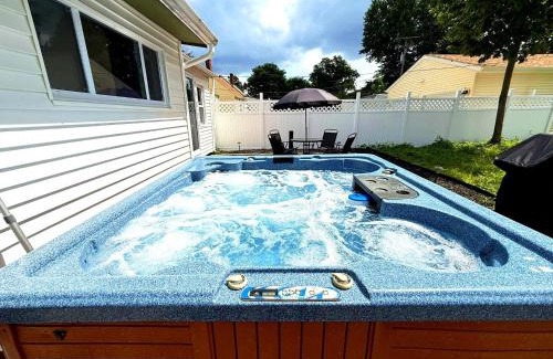 South Euclid House | South Euclid 4BR Luxe Escape with Hot Tub and BBQ