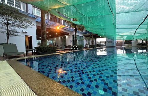 Ratchadaphisek Condo | Spacious 2-bedroom condo in welcoming Bangkok with WiFi, AC, fitness room