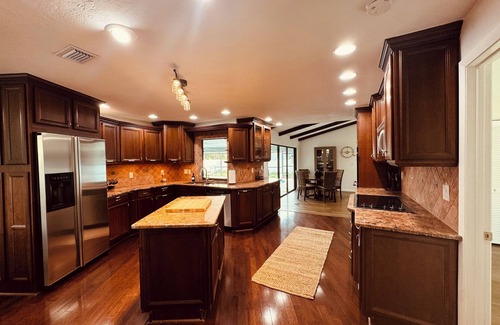 Biggar House | Spacious 4-bedroom house with heated pool great for large groups.