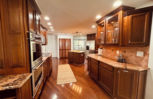 Biggar House | Spacious 4-bedroom house with heated pool great for large groups.