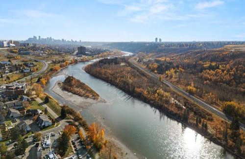 Montgomery House | Spacious 4-Bedroom Retreat Near Bow River with Foosball, Dart Board, Movie Room
