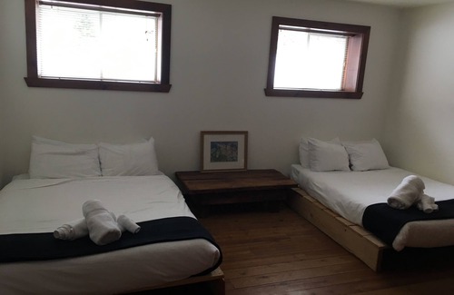 Lac Superieur Village Cabin | Spacious 6 person chalet w/ indoor fireplace, and private hot tub & sauna