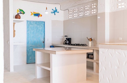 Rincon Apartment | Spacious beachfront house in Rincón del Mar, white, comfortable, fresh and bright.