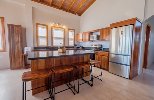 Caye Caulker Apartment | Spacious beachfront retreat with a soaking tub - pool, canoes, dock, & grill