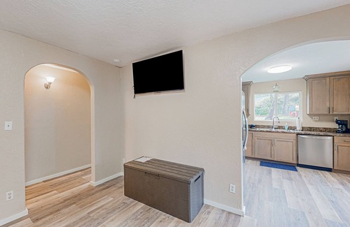 Coos Bay House | Spacious coastal property with separate living quarters, wood stove, & grill