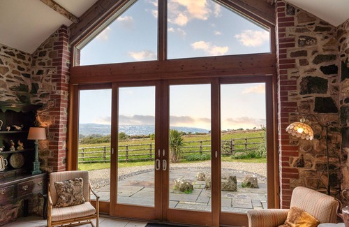 Fishguard House | Spacious converted rural barn. Sea views, large grounds, family & pet friendly.