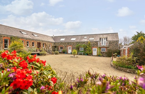 Fishguard House | Spacious converted rural barn. Sea views, large grounds, family & pet friendly.