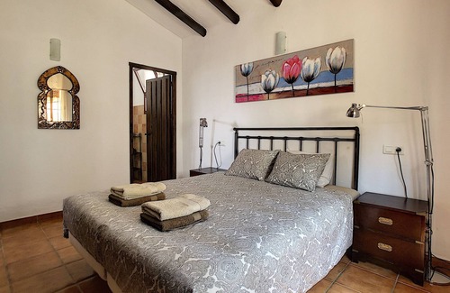 Canillas de Aceituno Villa | Spacious vacation home, adjacent to natural park, with shared pool.