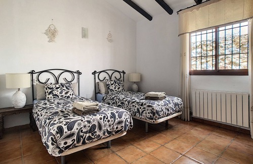 Canillas de Aceituno Villa | Spacious vacation home, adjacent to natural park, with shared pool.