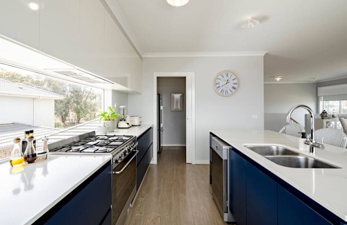 St Leonards Apartment | Spacious Hamptons-style home with heated pool