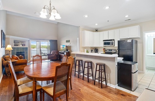 Sunrise Beach Condo | Spacious Lakeview Penthouse with Screened Balcony, Pool, Boat Slip & Lake Access