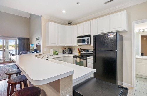 Sunrise Beach Condo | Spacious Lakeview Penthouse with Screened Balcony, Pool, Boat Slip & Lake Access