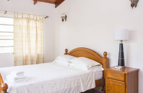 Dickenson Bay Villa | Spacious villa in mature gardens, near beaches, shops and reputable schools.
