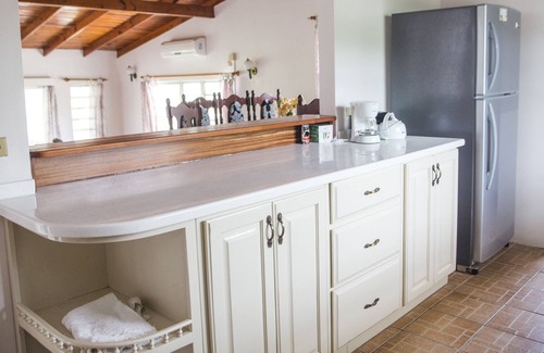 Dickenson Bay Villa | Spacious villa in mature gardens, near beaches, shops and reputable schools.