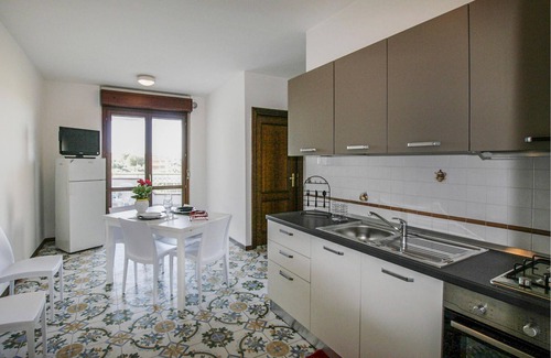 Villa Rosa Apartment | Spend a great vacation by the sea in this beachfront apartment.