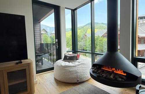 Stowe Area Apartment | SPRUCE PEAK TREEHOUSE 311 2 BED STEPS TO THE LIFTS MOUNTAIN VIEWS By Stowe Mountain Rentals