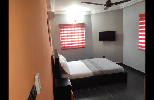 Lome House | Standard Double Bed in Royal Blue Guest House and Bar
