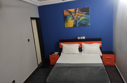Lome House | Standard Double Bed in Royal Blue Guest House and Bar