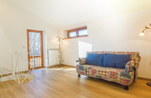 Arcidosso House | Step into a spacious cottage with tile floors and cozy corners where you can retreat.