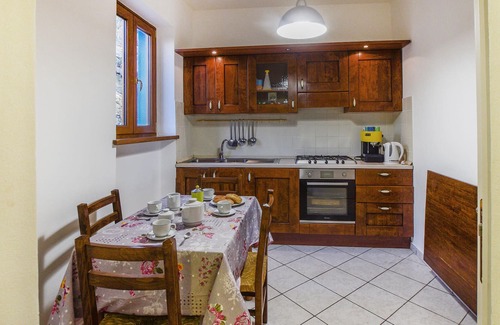 Arcidosso House | Step into a spacious cottage with tile floors and cozy corners where you can retreat.