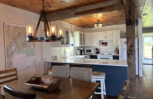 Mid-Coast and Islands Cottage | Step off the deck to enjoy the beach & a short walk down the scenic peninsula ~