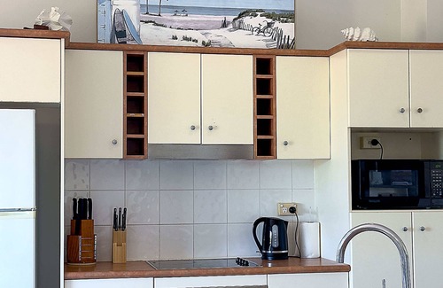 North Ward Apartment | Steps from The Strand 2BR & 2BA Riveria Retreat, Pool & Castle Hill Views
