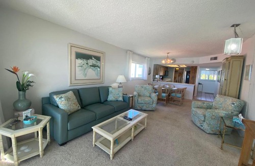 Mid Island House | Strandview #304 - Beachfront condo with screened-in patio and amazing view!