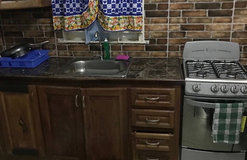Portmore Apartment | Studio Apartment E4 with AC, Kitchen, Bathroom. Cozy intimate Apartment.