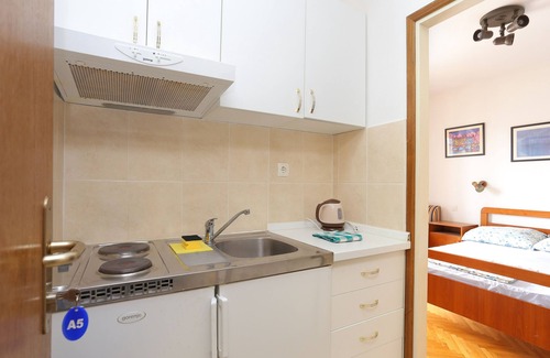 Municipality of Trogir Apartment | Studio flat with balcony and sea view Slatine, Čiovo (AS-13298-e)