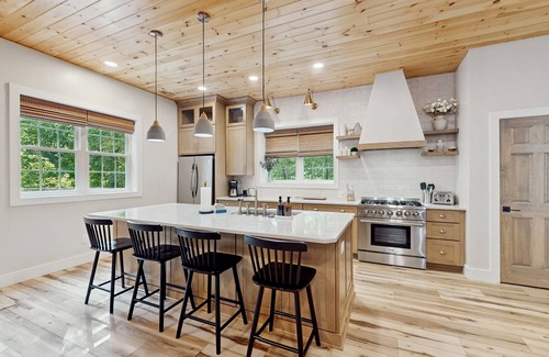Foscoe Cottage | Stunning dog-friendly cottage with riverfront patio, hot tub, fire pit, & views