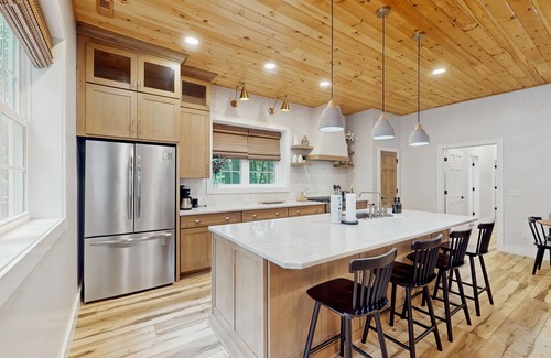 Foscoe Cottage | Stunning dog-friendly cottage with riverfront patio, hot tub, fire pit, & views