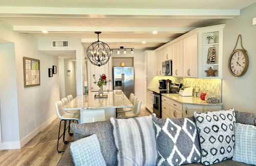 New Smyrna Beach Condo | STUNNING ground floor condo, direct OCEAN front, steps to community pool!