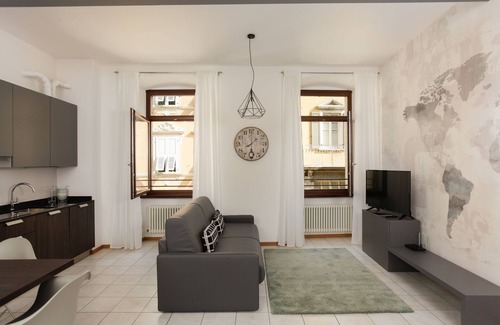 Riva del Garda Apartment | Stylish Apartment "RivApartmentsDowntowN - Travel" with a View of the Old Town of Riva del Garda, A/C & Wi-Fi