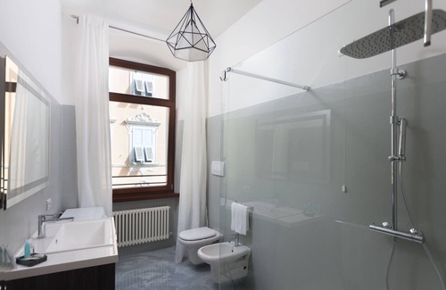 Riva del Garda Apartment | Stylish Apartment "RivApartmentsDowntowN - Travel" with a View of the Old Town of Riva del Garda, A/C & Wi-Fi