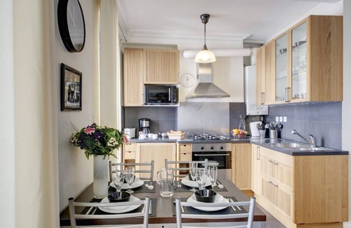 Strasbourg -Saint-Denis Apartment | STYLISH CONTEMPORARY APT: ELEGANT GRAY,RED & BLACK ACCENTS IN BOURGEOIS BUILDING