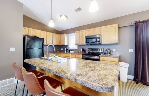 Douglas Condo | Stylish dog-friendly retreat with furnished deck, pool, & firepits