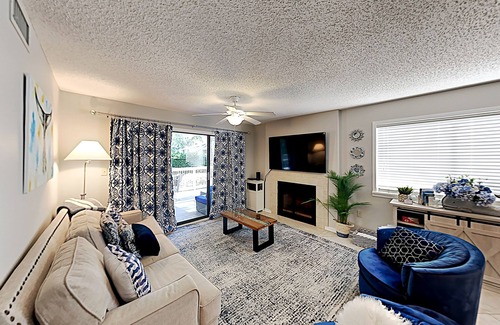 Arcadian Shores Condo | Stylish home with oversize deck & updated kitchen - walk to beach, pools, & gym