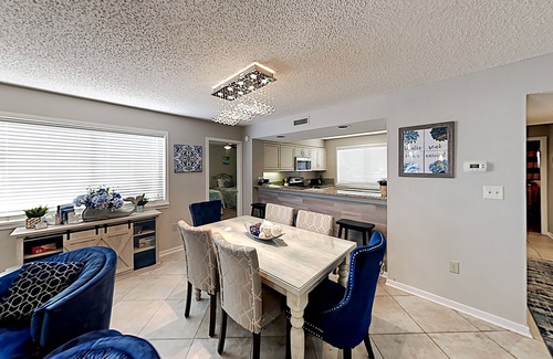 Arcadian Shores Condo | Stylish home with oversize deck & updated kitchen - walk to beach, pools, & gym